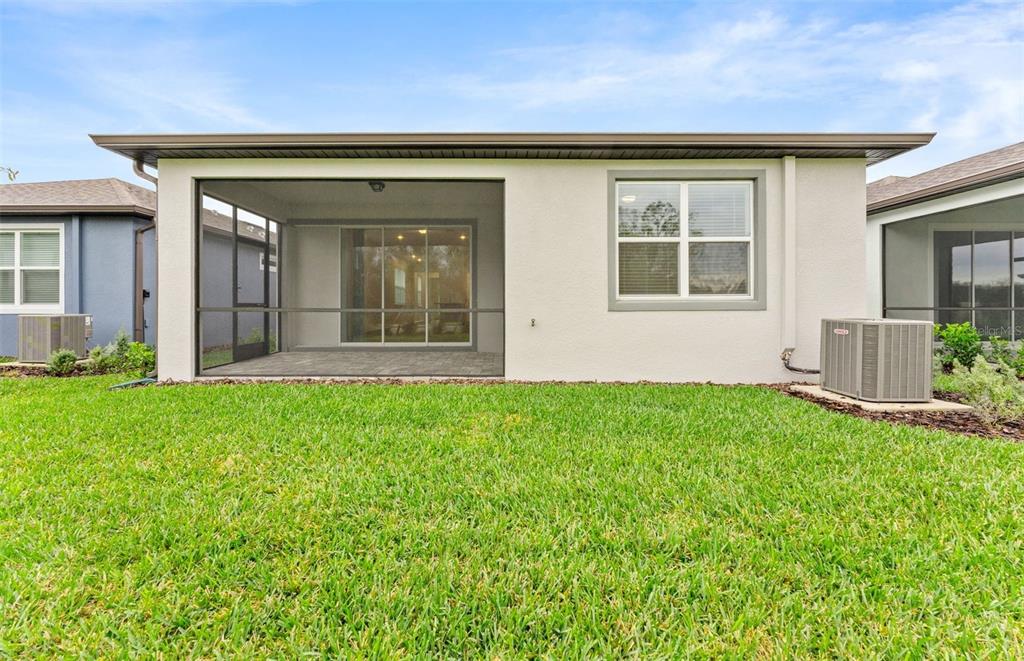 13748 Rocky Pne Place Spring Hill, FL 34610 - Photo 17 of 30 front view of a house with a yard