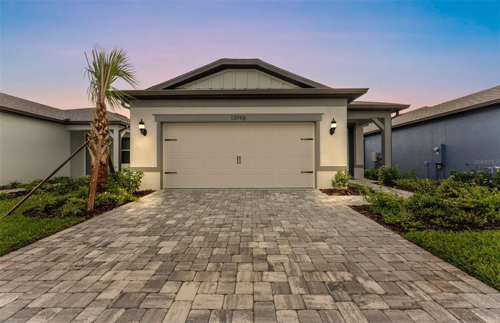 13748 Rocky Pne Place Spring Hill, FL 34610 - Photo 18 of 30 a front view of a house with garage