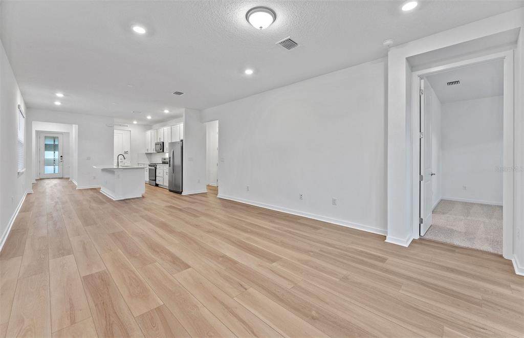 13748 Rocky Pne Place Spring Hill, FL 34610 - Photo 8 of 30 a view of a kitchen with a sink and a refrigerator