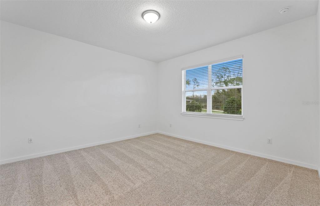 13748 Rocky Pne Place Spring Hill, FL 34610 - Photo 9 of 30 an empty room with a window