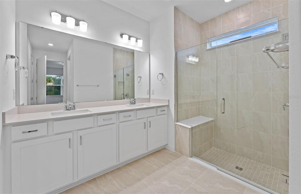 13748 Rocky Pne Place Spring Hill, FL 34610 - Photo 10 of 30 a spacious bathroom with double sink and a mirror