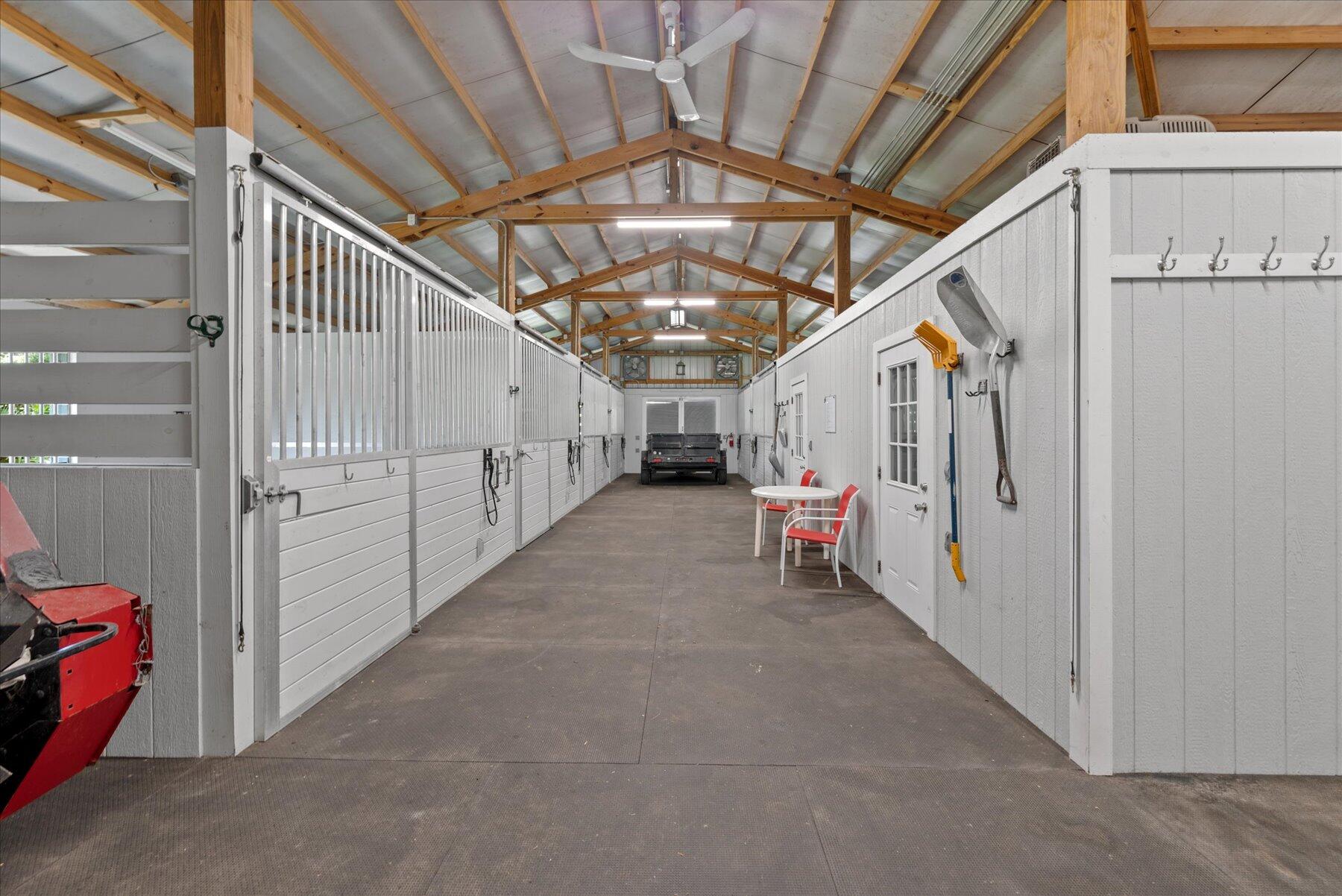 3676 Duellant Road Loxahatchee, FL 33470 - Photo 27 of 71 center aisle barn with 10 stalls