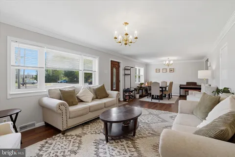 a view of a livingroom with furniture and wooden floor