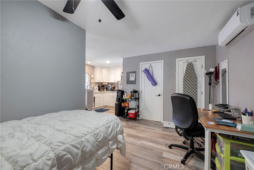 11309 Telechron Avenue, Unit B Whittier, CA 90605 - Photo 14 of 17 a bed room with a bed and a chair