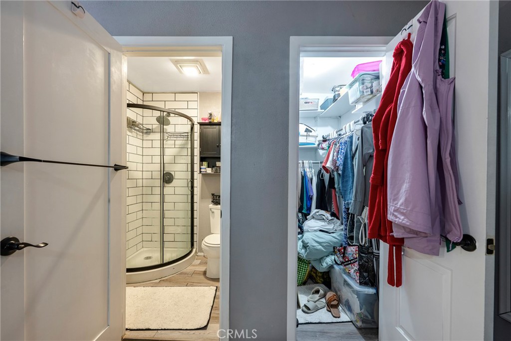 11309 Telechron Avenue, Unit B Whittier, CA 90605 - Photo 15 of 17 a view of walk in closet with clothes and shoes