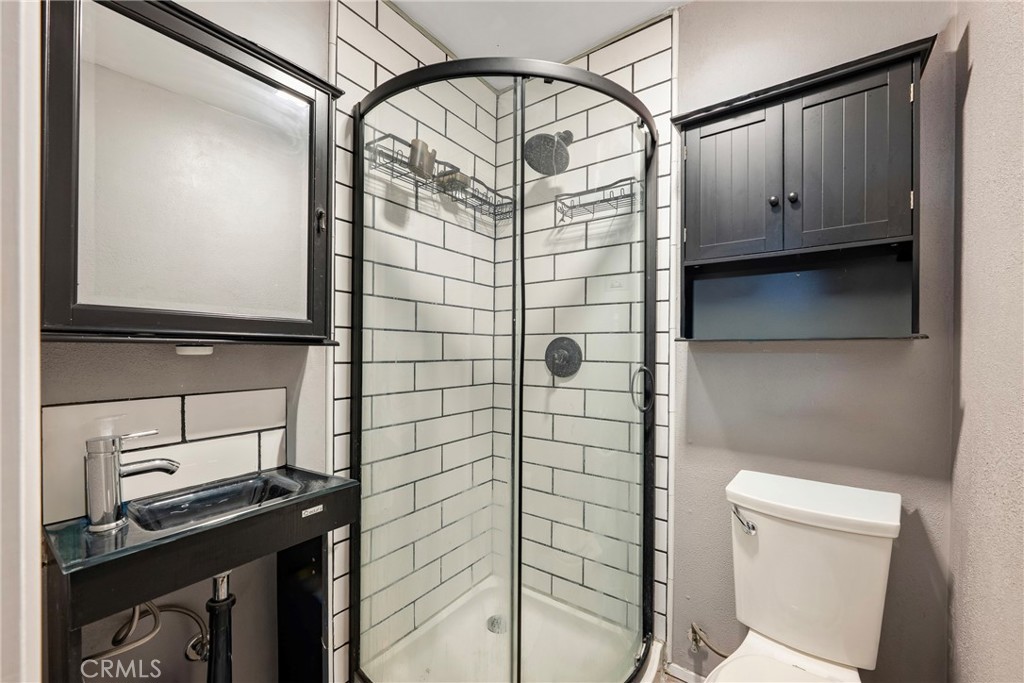 11309 Telechron Avenue, Unit B Whittier, CA 90605 - Photo 17 of 17 a bathroom with a shower and a toilet