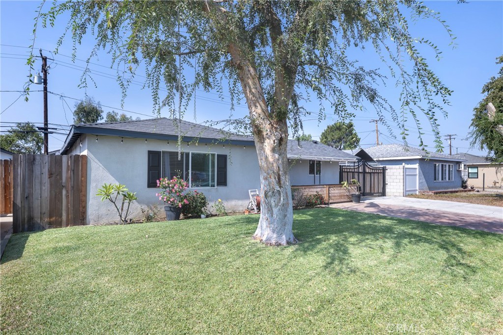 11309 Telechron Avenue, Unit B Whittier, CA 90605 - Photo 2 of 17 a house that has a tree in front of it