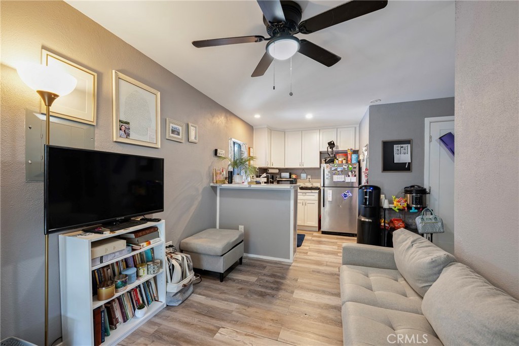11309 Telechron Avenue, Unit B Whittier, CA 90605 - Photo 5 of 17 a living room with furniture and a flat screen tv