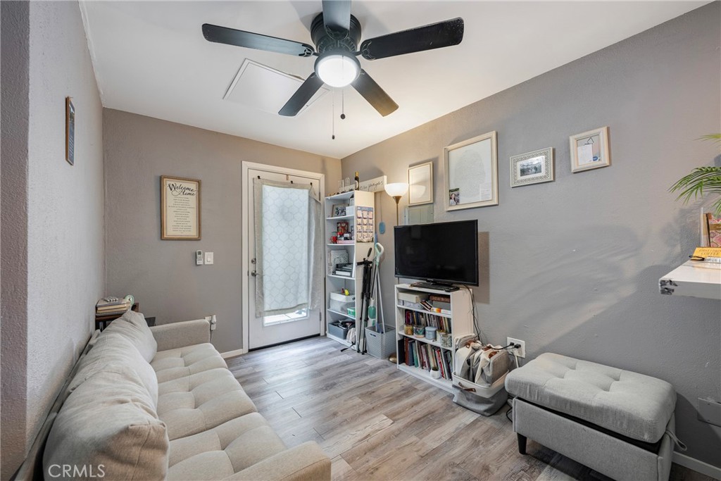 11309 Telechron Avenue, Unit B Whittier, CA 90605 - Photo 7 of 17 a living room with furniture and a flat screen tv