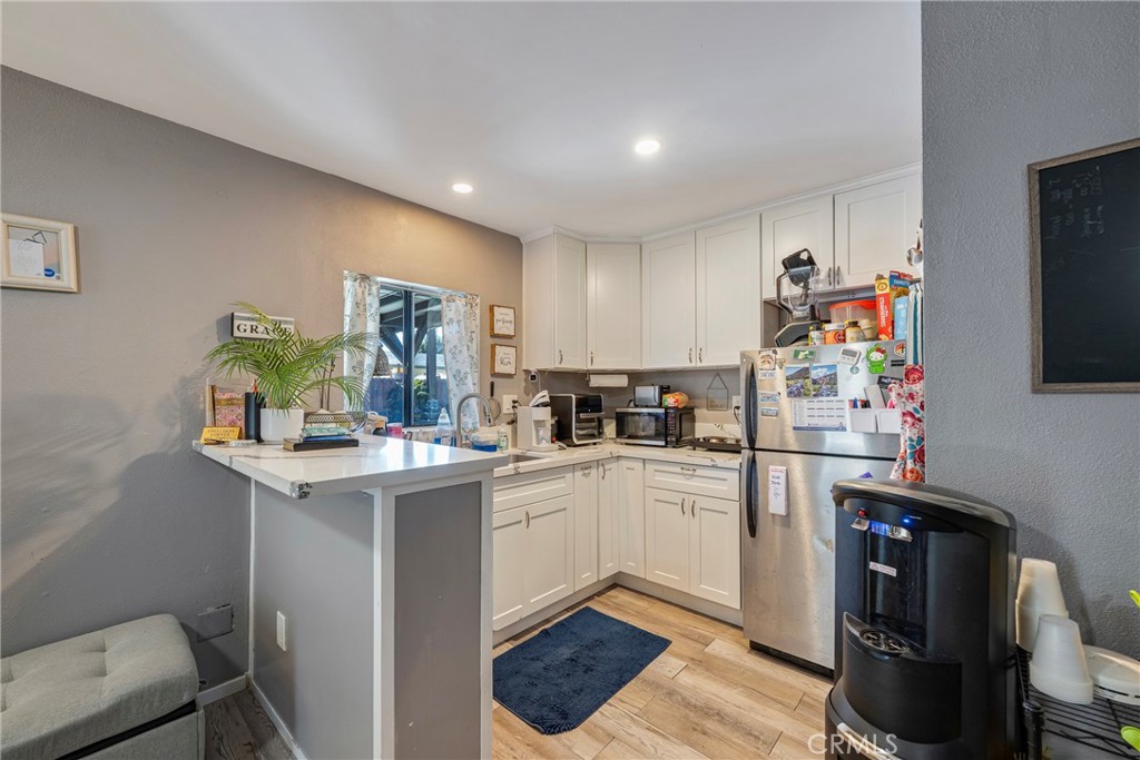 11309 Telechron Avenue, Unit B Whittier, CA 90605 - Photo 8 of 17 a kitchen with a sink cabinets and window