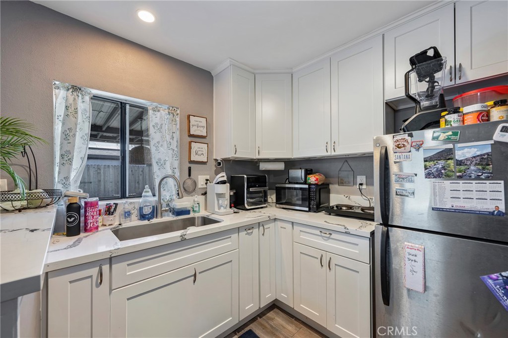 11309 Telechron Avenue, Unit B Whittier, CA 90605 - Photo 9 of 17 a kitchen with stainless steel appliances granite countertop a sink and cabinets