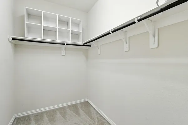 a view of an empty walk in closet