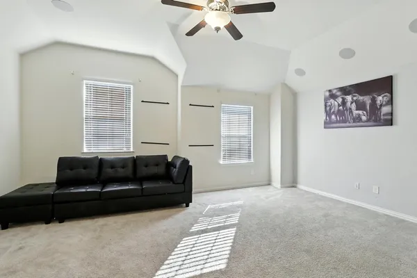 a bed room with a bed and a chair