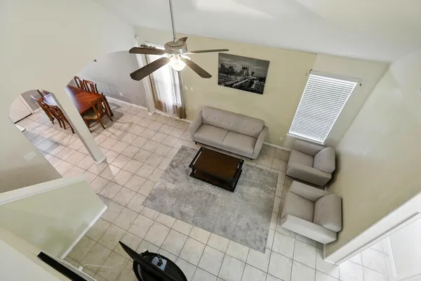 a living room with furniture and a rug
