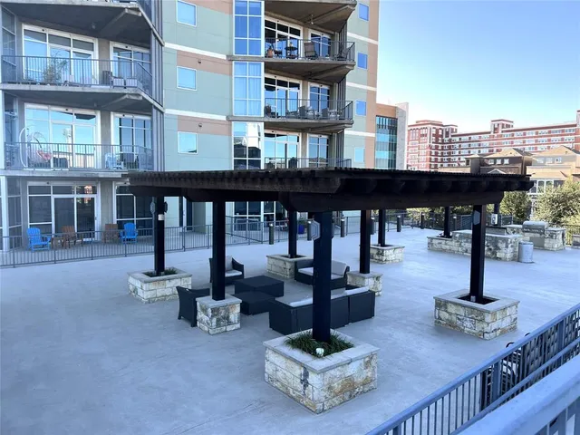 a view of a building with sitting area