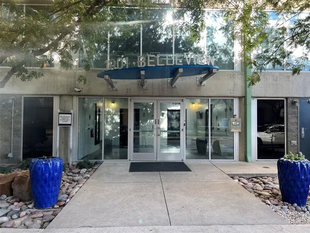 a view of a building with a potted plant in front of it