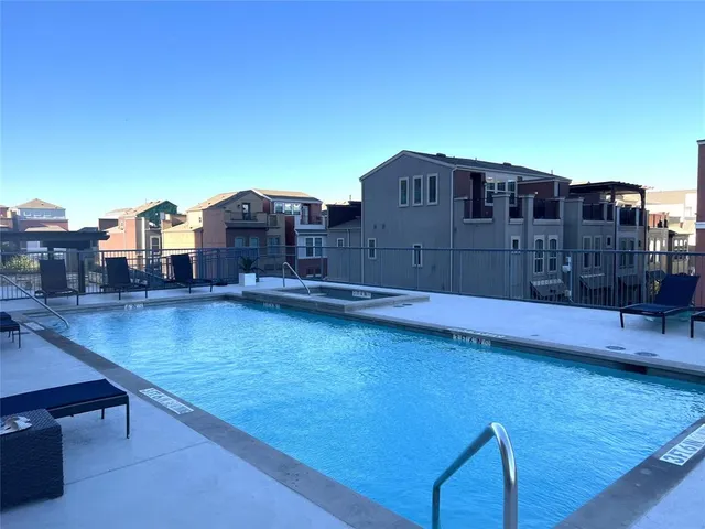 a view of a swimming pool with a terrace