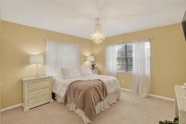 a bed room with a bed and a night stand