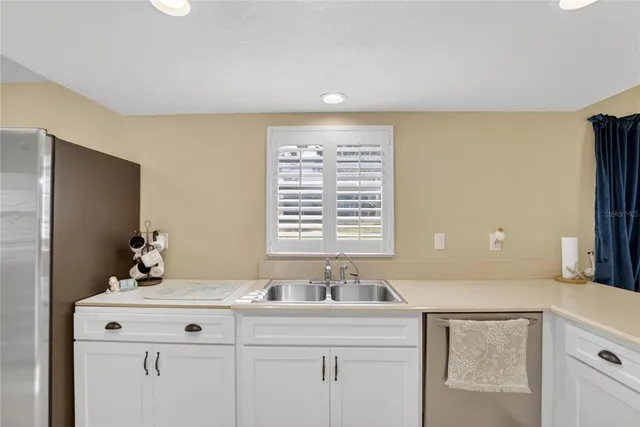 a bathroom with a sink and a window