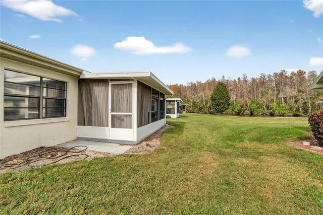 a view of a lake with houses in the back