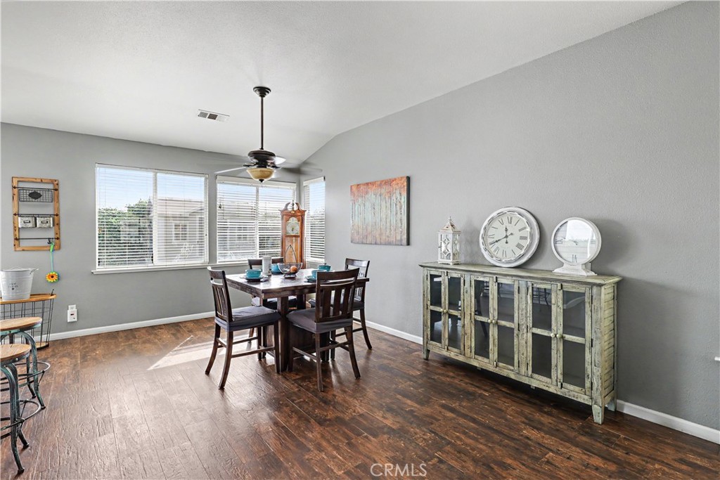 3632 Swan Court Merced, CA 95340 - Photo 11 of 50 a view of a dining room with furniture window and wooden floor