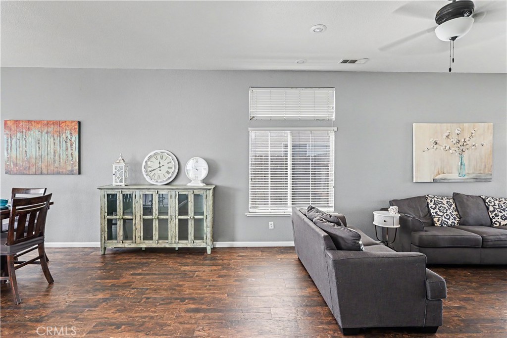 3632 Swan Court Merced, CA 95340 - Photo 12 of 50 a living room with furniture a window and wooden floor