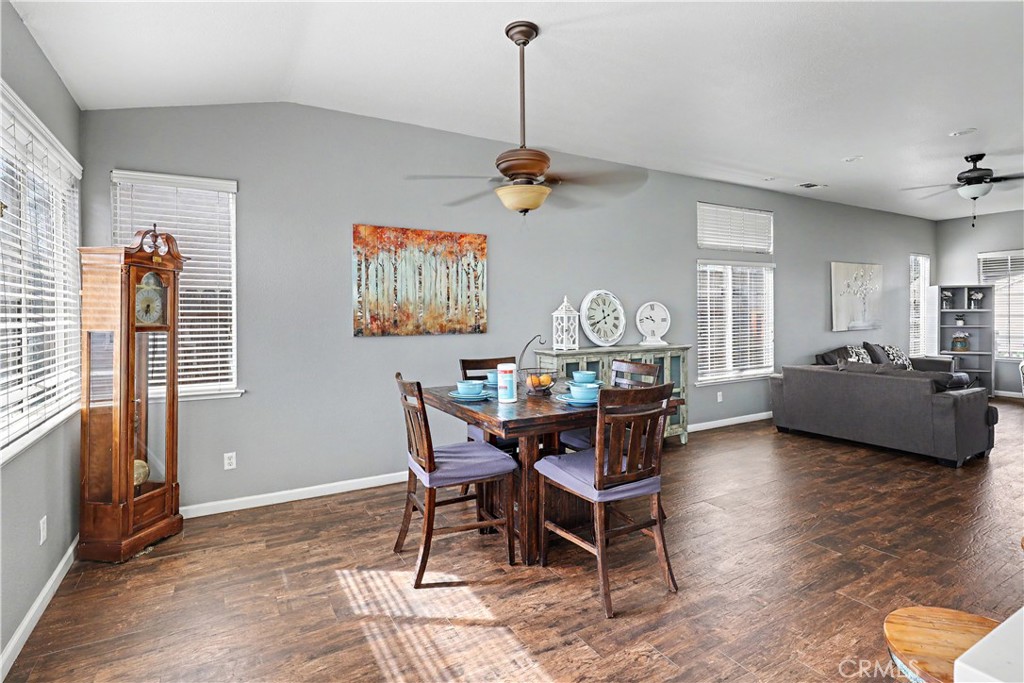 3632 Swan Court Merced, CA 95340 - Photo 15 of 50 a view of a dining room with furniture window and wooden floor