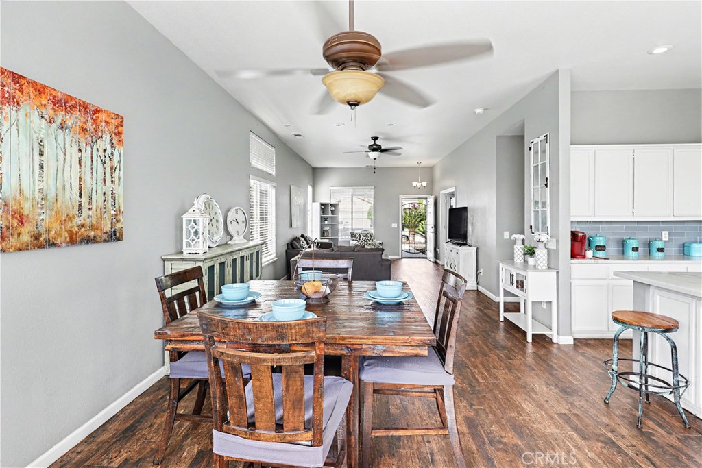 3632 Swan Court Merced, CA 95340 - Photo 17 of 50 a view of a dining room with furniture window and wooden floor