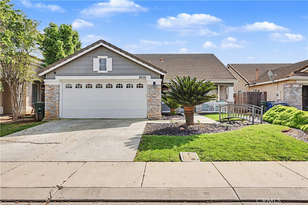 3632 Swan Court Merced, CA 95340 - Photo 2 of 50 a view of a house with a yard and potted plants
