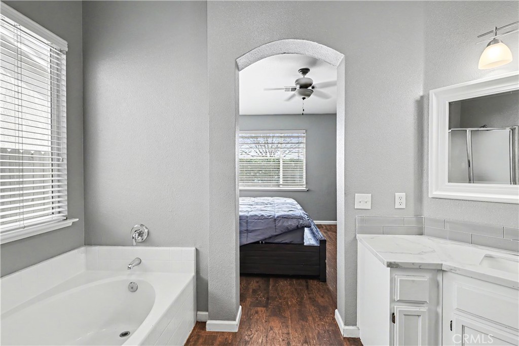 3632 Swan Court Merced, CA 95340 - Photo 31 of 50 a bathroom with a tub sink and mirror