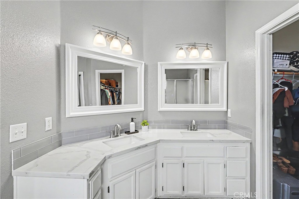 3632 Swan Court Merced, CA 95340 - Photo 32 of 50 a bathroom with a sink vanity and a mirror
