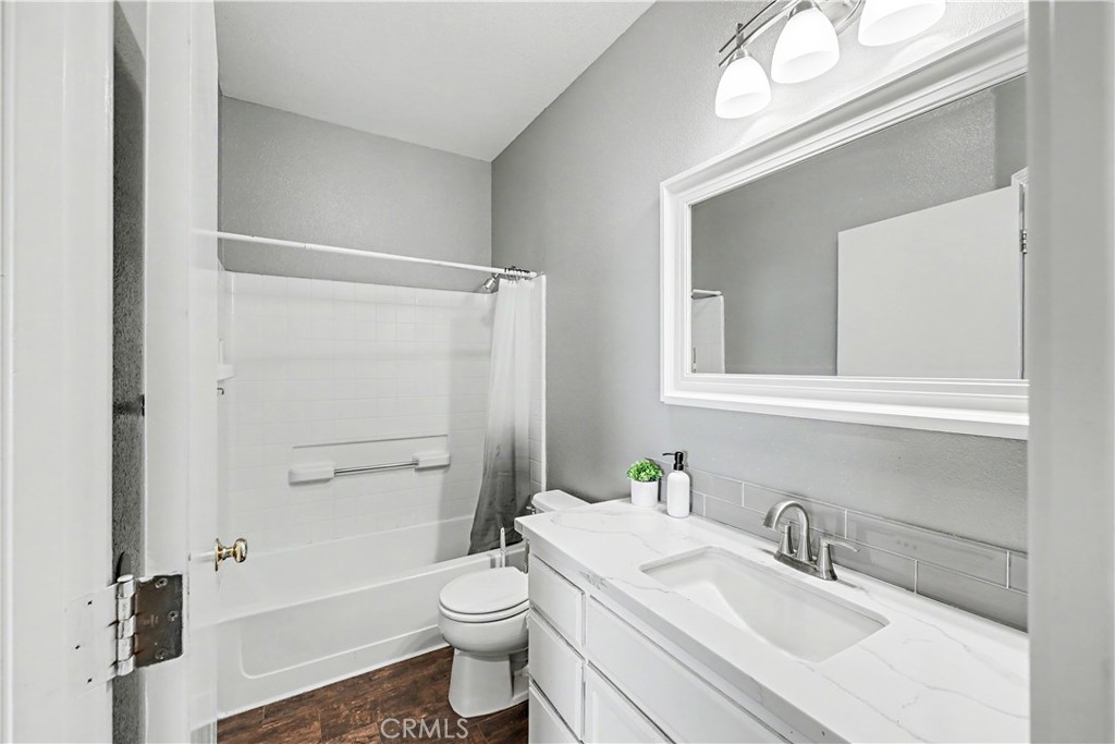 3632 Swan Court Merced, CA 95340 - Photo 36 of 50 a bathroom with a sink toilet vanity and shower