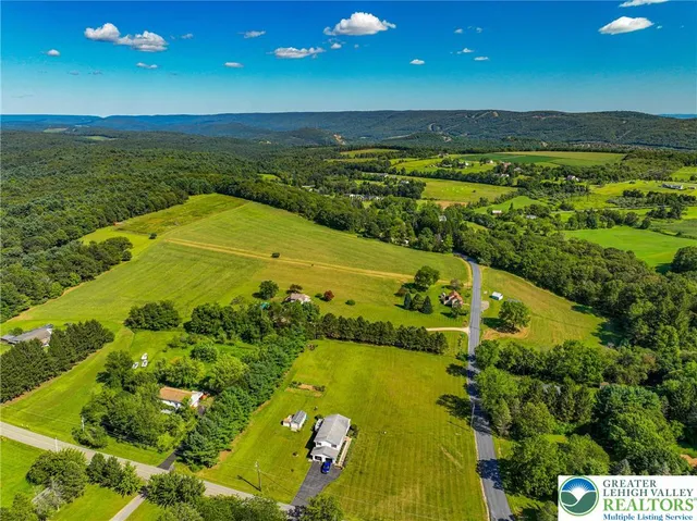 a view of an ocean and a houses