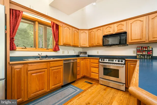a living room with furniture city view and large windows