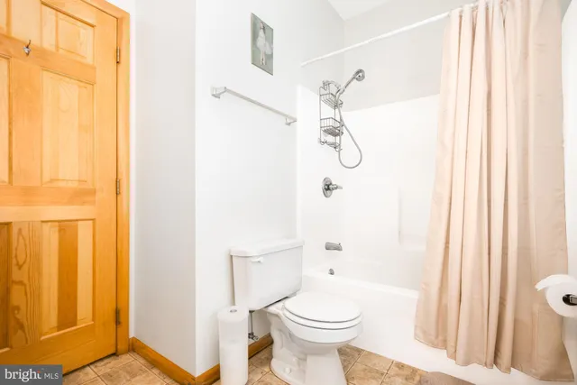 a bathroom with a double vanity sink mirror and