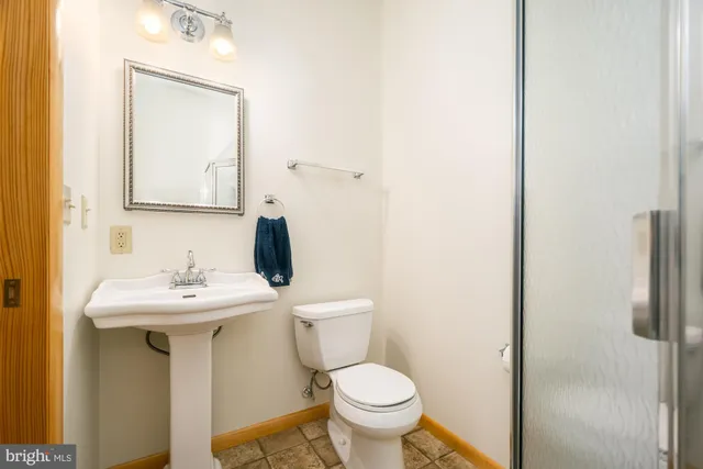 a living room with lots of furniture and a chandelier
