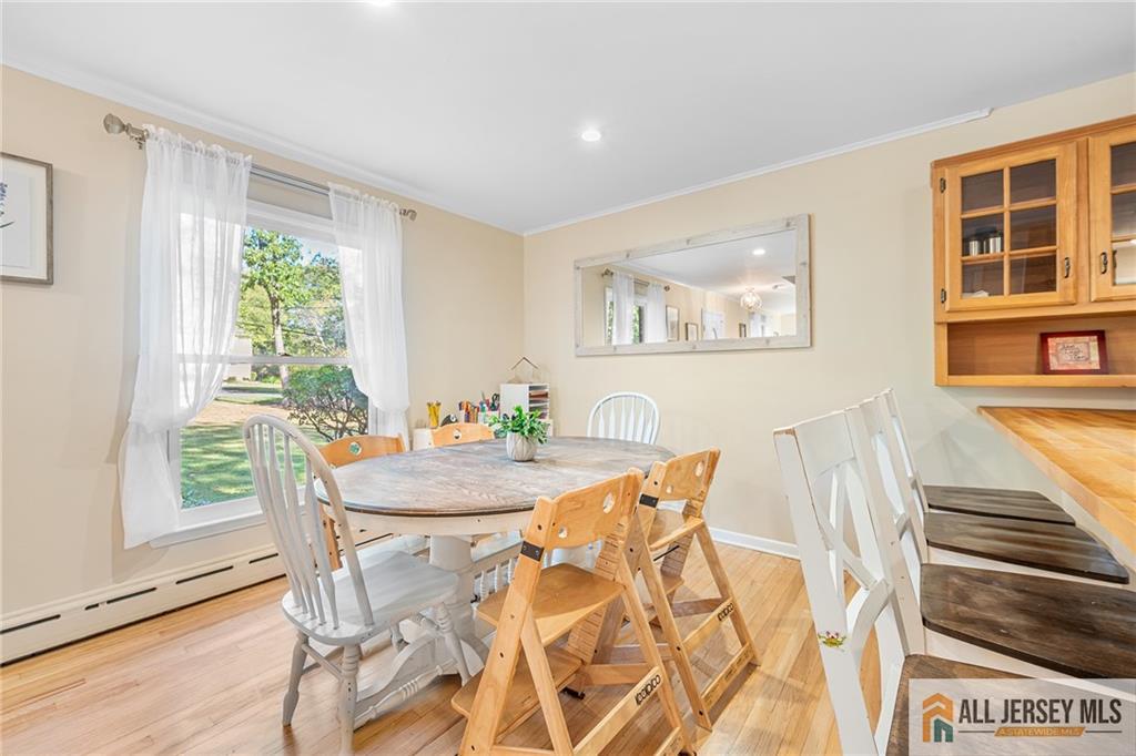 1266 Mt Vernon Road Bridgewater, NJ 08807 - Photo 11 of 44 a view of a dining room with furniture window and wooden floor