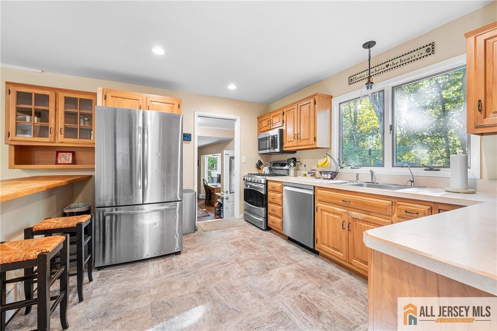 1266 Mt Vernon Road Bridgewater, NJ 08807 - Photo 13 of 44 a kitchen with stainless steel appliances granite countertop a refrigerator a sink dishwasher a stove and a refrigerator with wooden floor