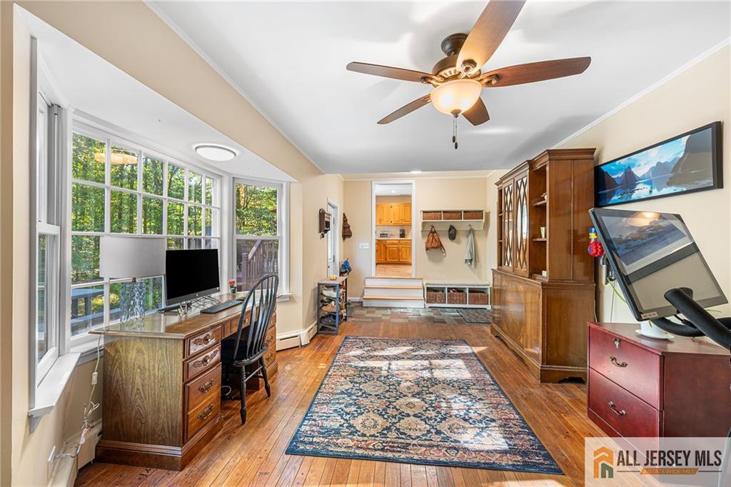 1266 Mt Vernon Road Bridgewater, NJ 08807 - Photo 17 of 44 a view of a workspace with furniture and a window