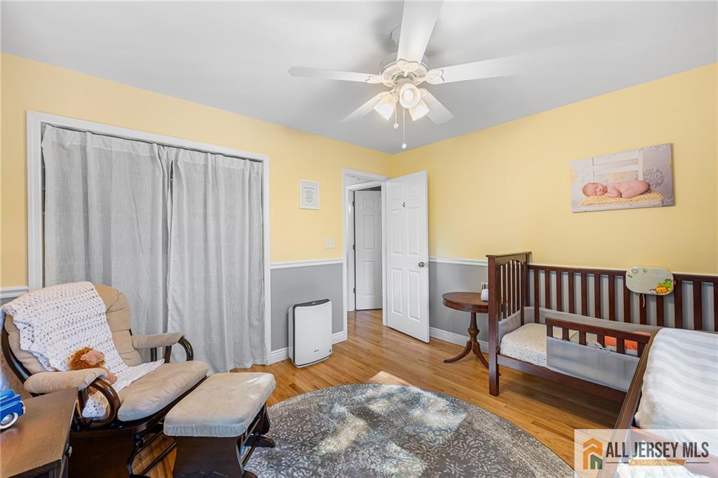 1266 Mt Vernon Road Bridgewater, NJ 08807 - Photo 20 of 44 a bedroom with a bed and wooden floor