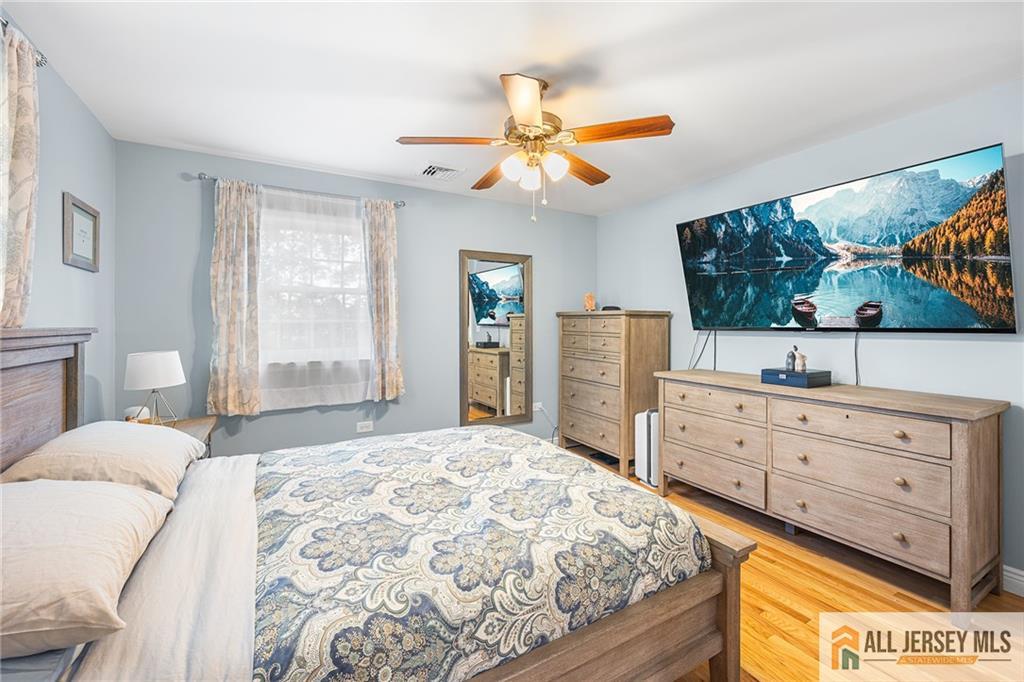 1266 Mt Vernon Road Bridgewater, NJ 08807 - Photo 25 of 44 a bedroom with a bed and a flat screen tv