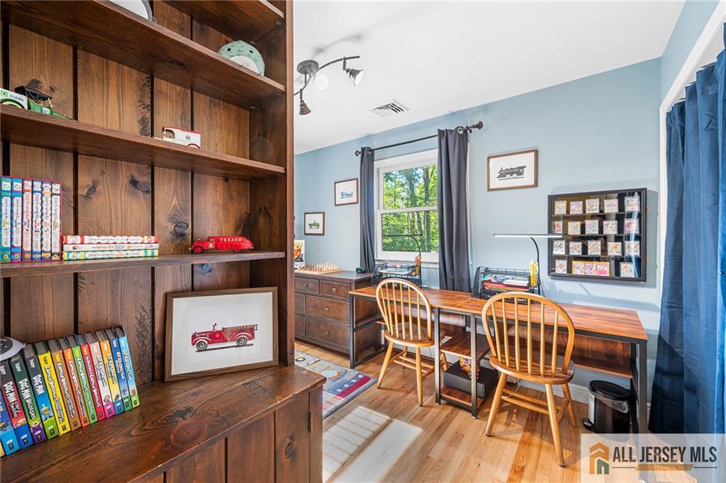 1266 Mt Vernon Road Bridgewater, NJ 08807 - Photo 30 of 44 a table and chairs in a room and a window