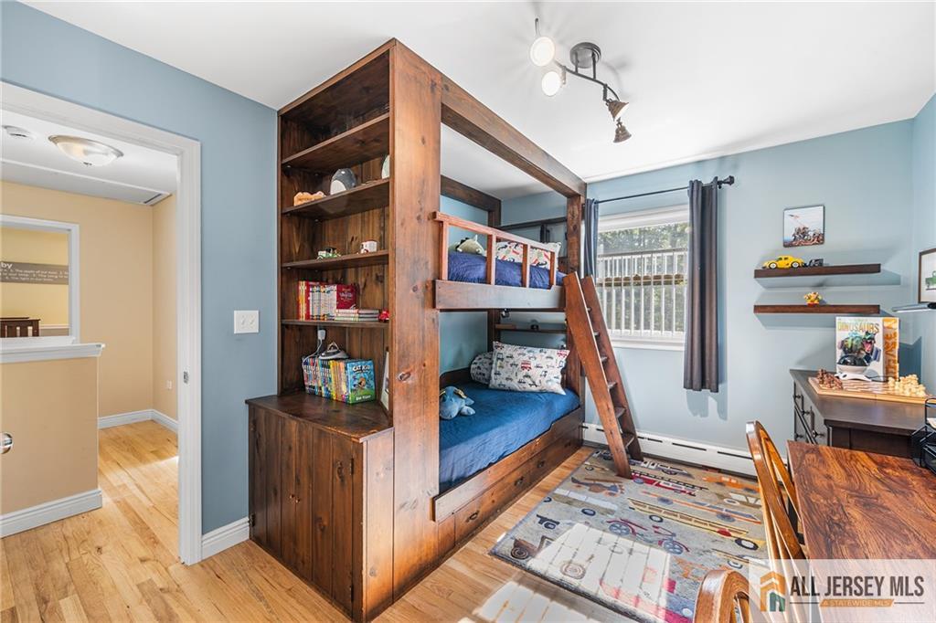 1266 Mt Vernon Road Bridgewater, NJ 08807 - Photo 31 of 44 a bedroom with furniture and a book shelf