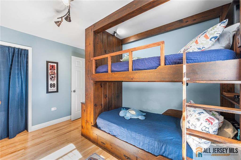 1266 Mt Vernon Road Bridgewater, NJ 08807 - Photo 32 of 44 a bedroom with a bed and painting on the wall