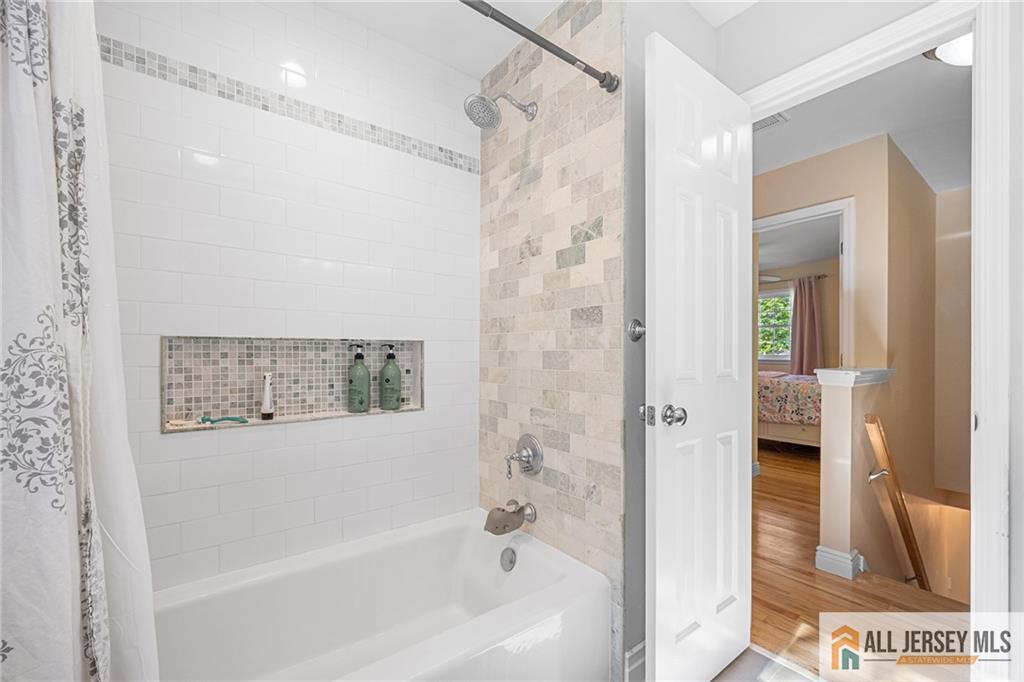 1266 Mt Vernon Road Bridgewater, NJ 08807 - Photo 34 of 44 a bathroom with a bathtub and a shower
