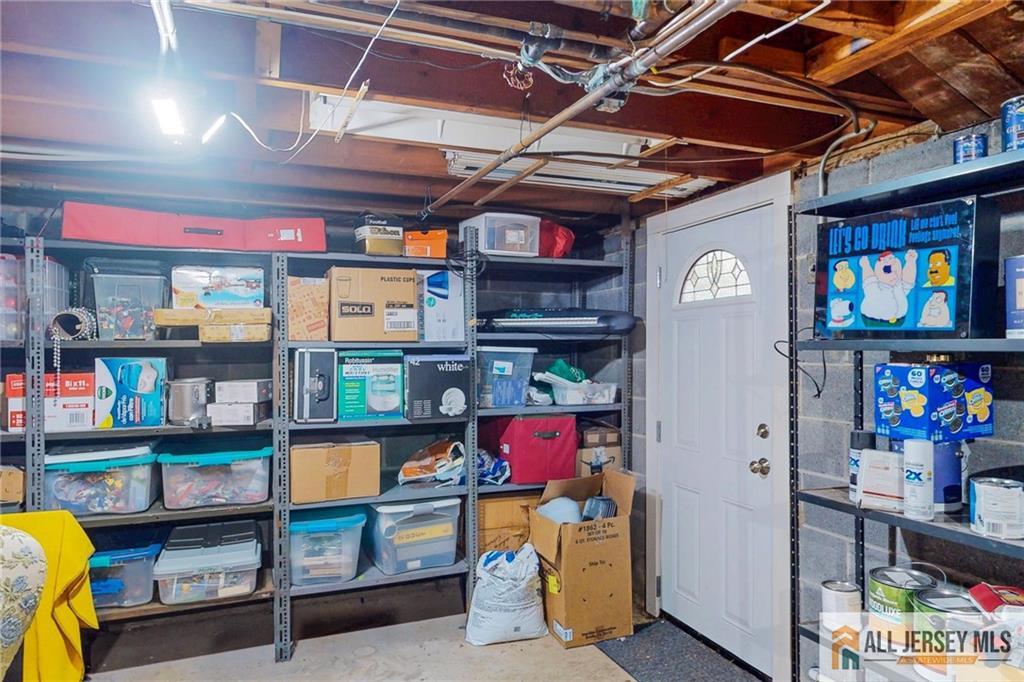 1266 Mt Vernon Road Bridgewater, NJ 08807 - Photo 35 of 44 a utility room with stainless steel appliances kitchen island granite countertop lots of clutter