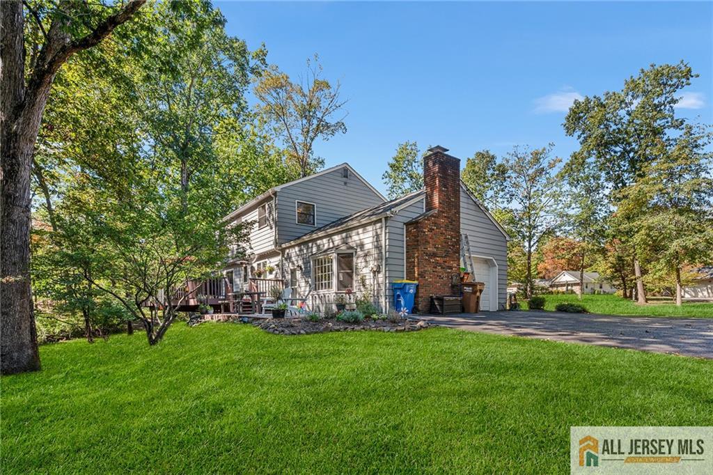 1266 Mt Vernon Road Bridgewater, NJ 08807 - Photo 39 of 44 a view of a house with a big yard and large trees