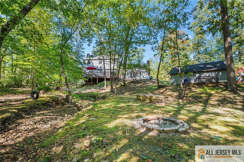 1266 Mt Vernon Road Bridgewater, NJ 08807 - Photo 42 of 44 a backyard of a house with lots of green space