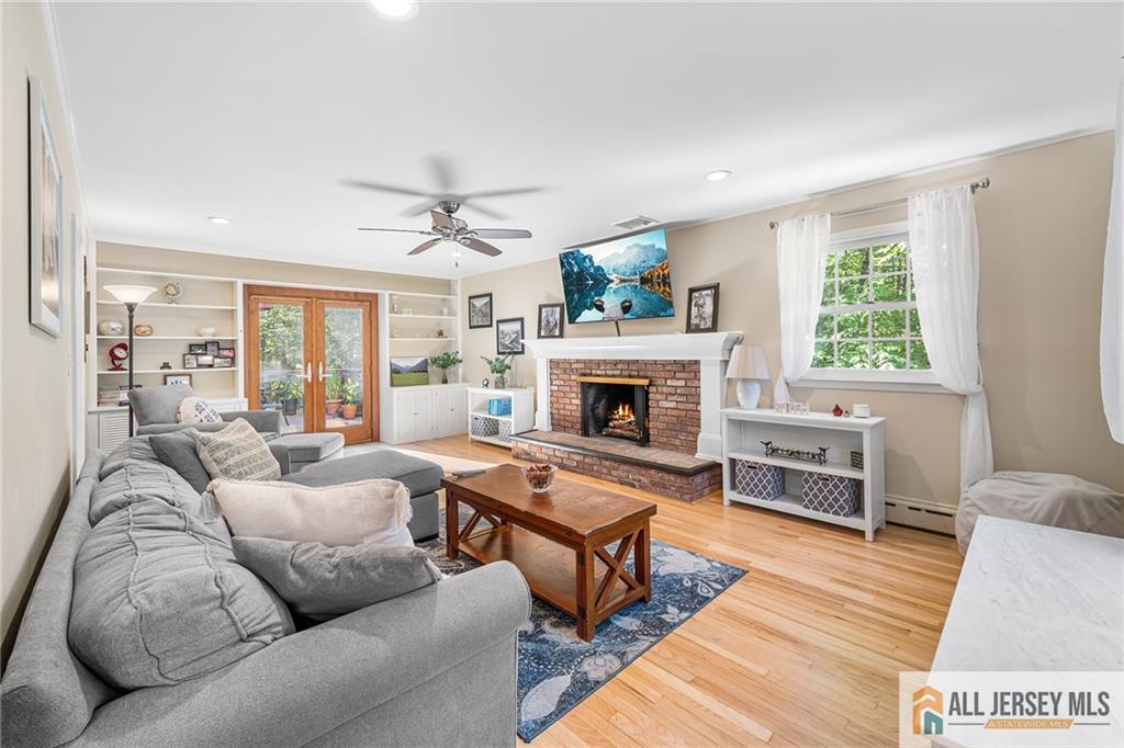 1266 Mt Vernon Road Bridgewater, NJ 08807 - Photo 5 of 44 a living room with furniture and a fireplace