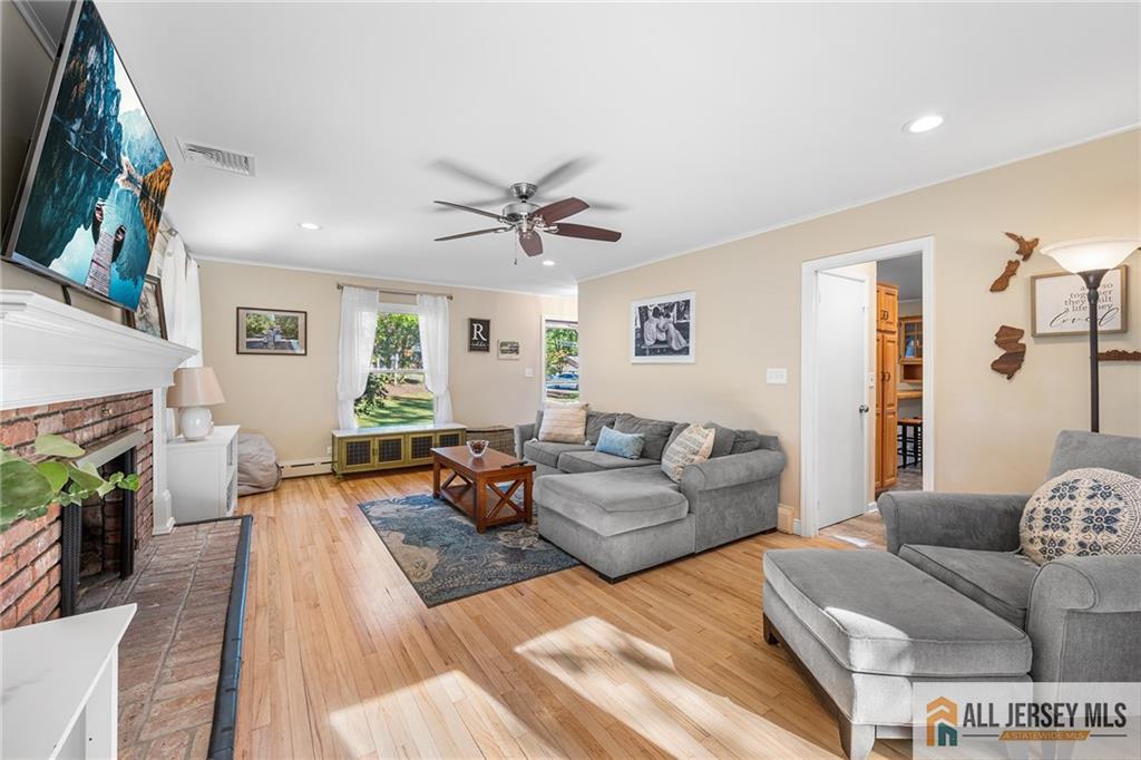 1266 Mt Vernon Road Bridgewater, NJ 08807 - Photo 7 of 44 a living room with furniture and a fireplace
